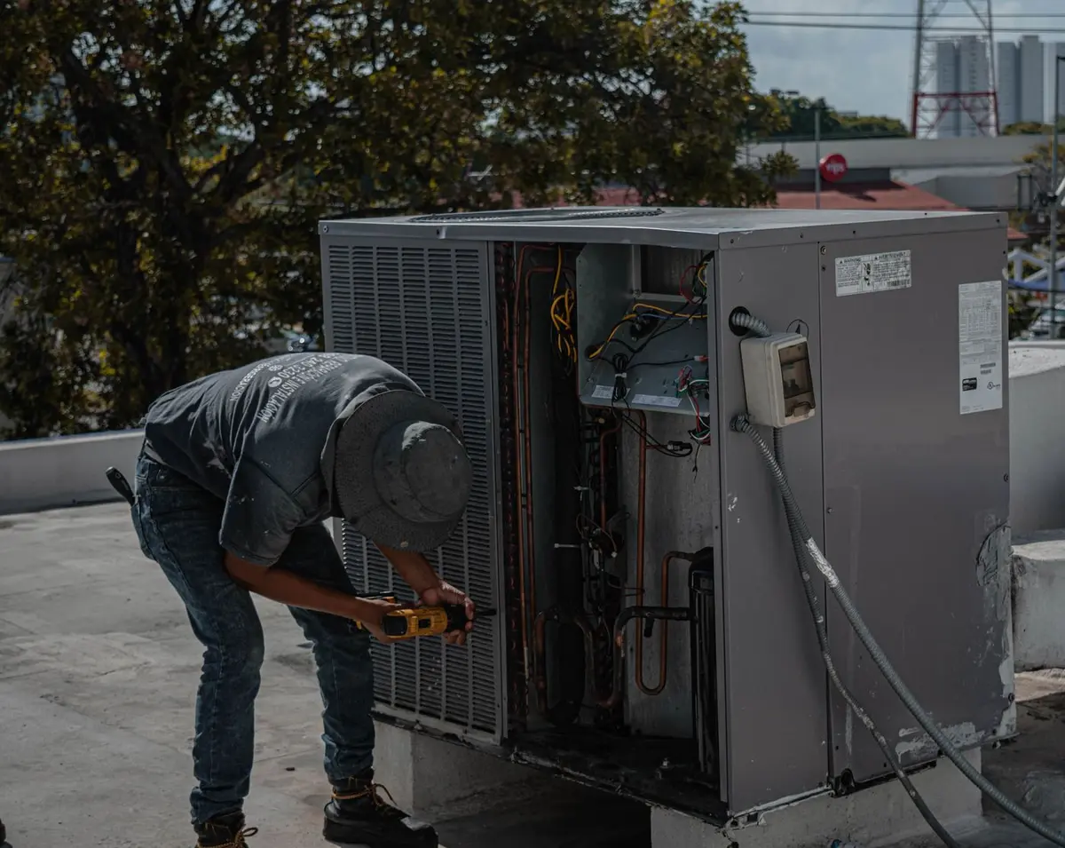 Technician inspecting an air conditioning system